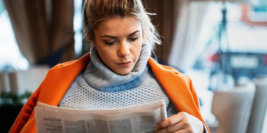 Woman reading a newspaper